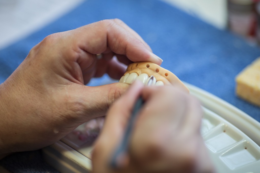 The Courtyard preparing veneers for a patient's treatment